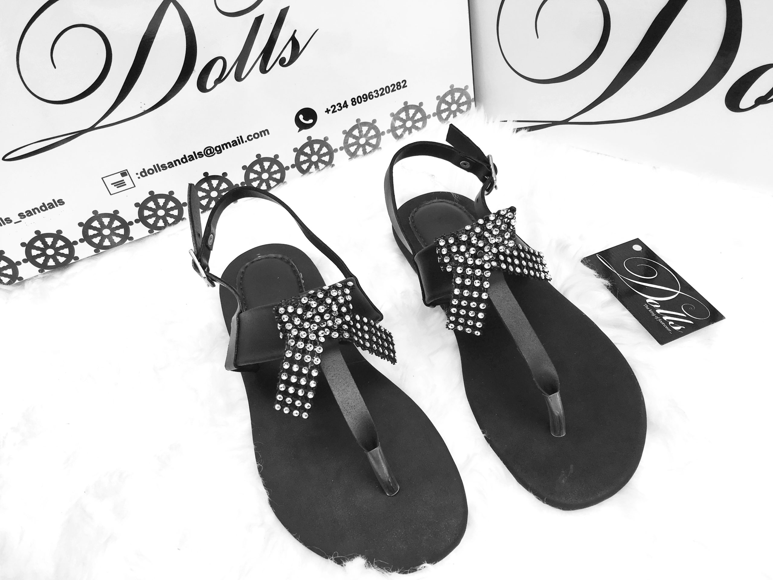 picture of a black embellished female sandals by Dolls leather products